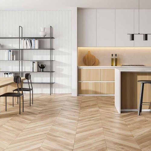 beautiful herringbone patterned hardwood floors in modern kitchen