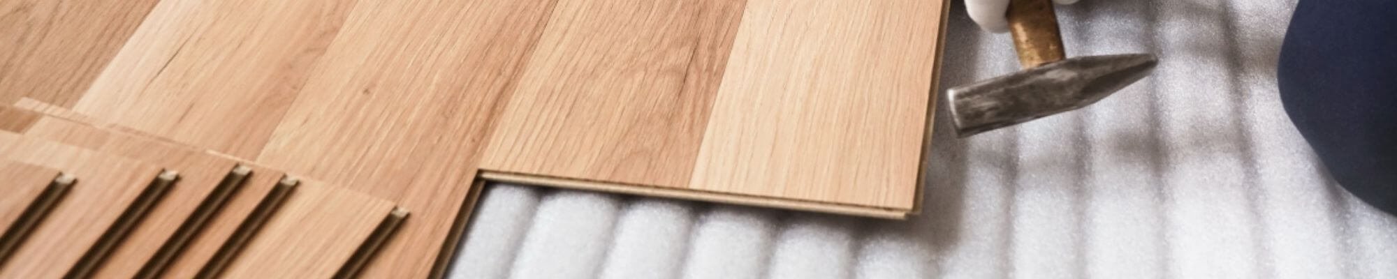 skilled professional installing luxury vinyl click flooring